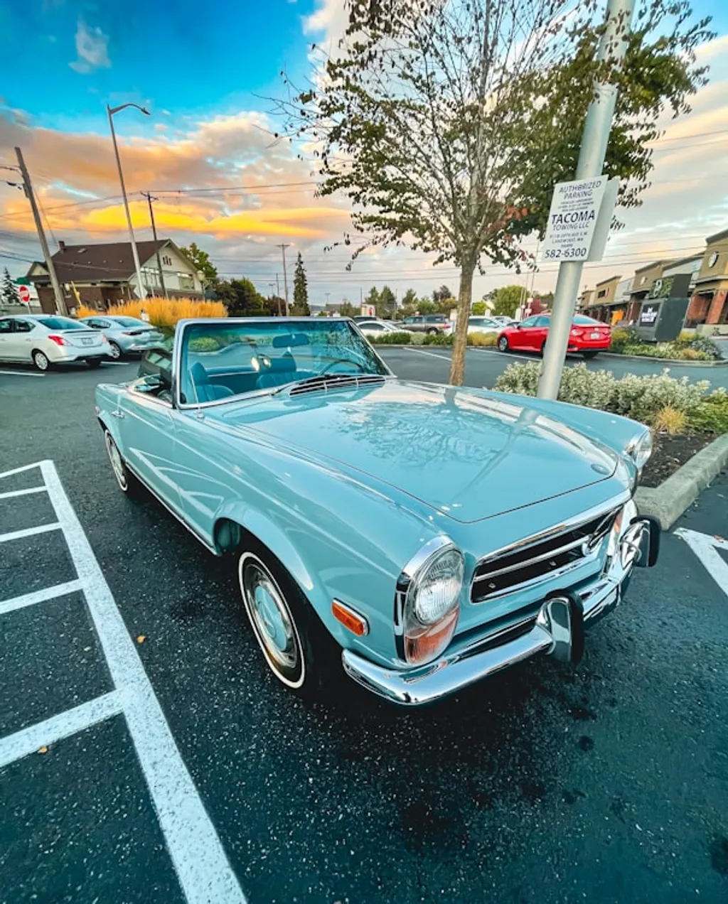 blue car parked in a parking lot